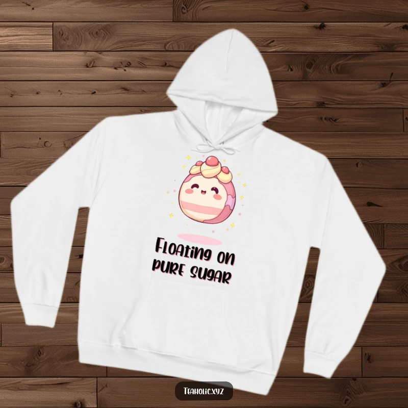Funny hoodie featuring a round cake character levitating with a gentle sparkle, offering magical comfort.