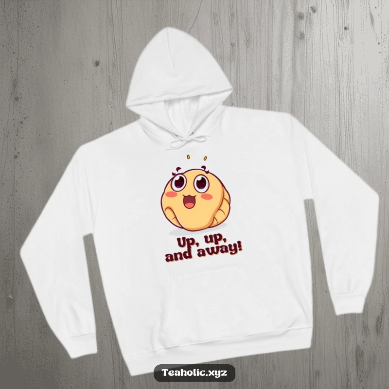 Funny croissant hoodie featuring a surprised pastry floating joyfully upwards, offering comfort and humor for a chilly day.